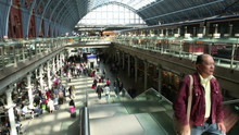 Time Lapse Of Travelers And Commuters Passing Through A London Railway Station