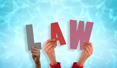 Fototapete - Composite image of hands holding up law