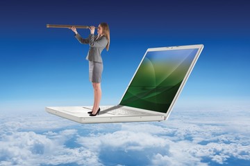 Poster - Composite image of businesswoman looking through a telescope