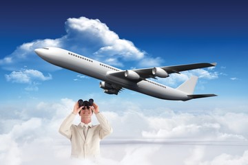 Poster - Composite image of confident businessman with binoculars