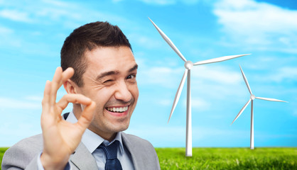 Canvas Print - happy businessman in suit showing ok hand sign