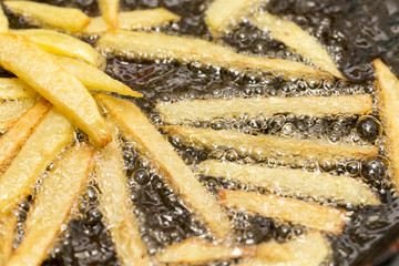 Canvas Print - French fries fried in a pan