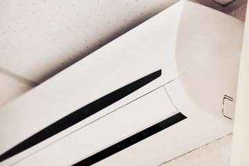 Air conditioner on wall background