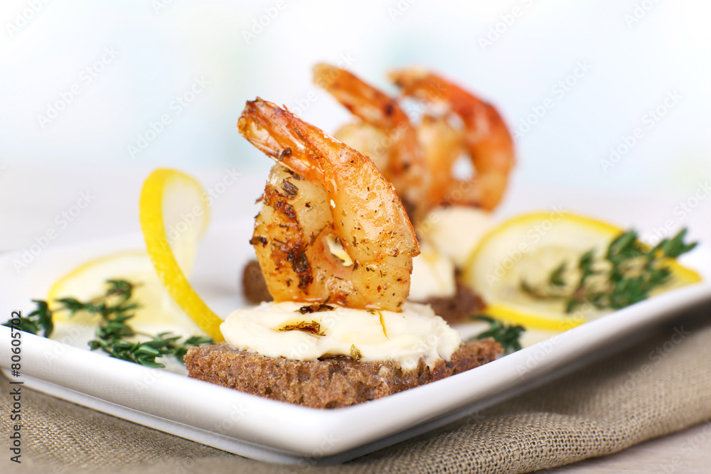 Appetizer canape with shrimp and lemon