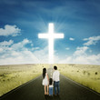 © Creativa Images - Family on the street with a cross