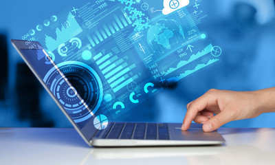 modern notebook computer with future technology symbols