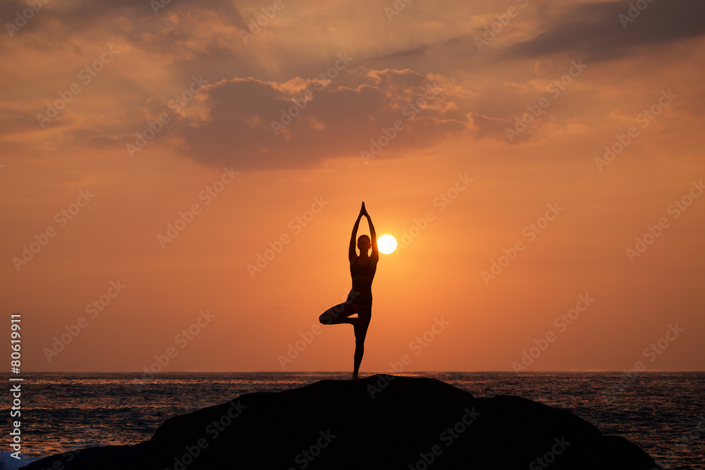 Vrikshasana tree pose from yoga by woman silhouette on sunset Stock ...