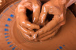 © rodimovpavel - hands of artisan working with clay on pottery wheel