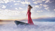 © konradbak - Alone smart woman paddling in the clouds