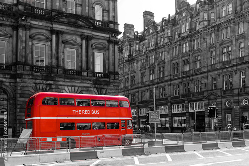 Naklejka na kafelki red double decker vintage bus in a street
