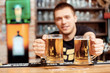 © zinkevych - Barman with glasses of beer