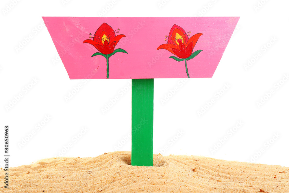 Wooden sign standing in sand isolated on white