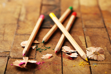 Wall Mural - Wooden colorful pencils with sharpening shavings on wooden