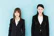 © taka - asian businesswomen on blue background