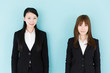 © taka - asian businesswomen on blue background