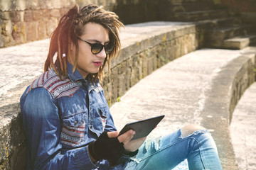 Wall Mural - freelancer guy with dreadlocks warm filter applied