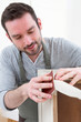 © Production Perig - Young attractive carpenter working in his workshop