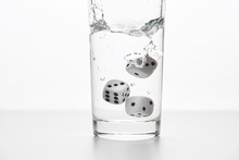 Dices In A Glass Of Water