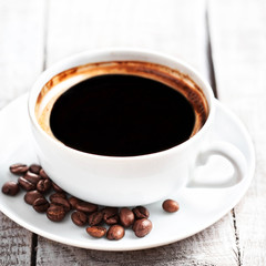 Poster - Coffee Espresso. Coffee cup  with roasted coffee beans over   wh