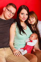 Family with newborn baby girl portrait