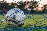 Fototapeta Sport - A football in a football field