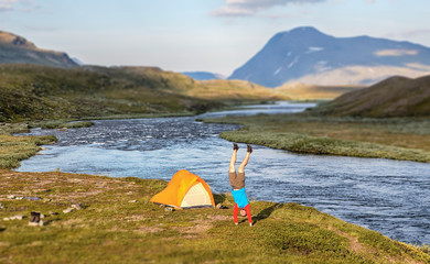 Wall Mural - handstand in front of the tent