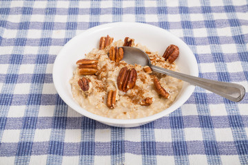 Wall Mural - Oatmeal with Pecans and Cinnamon and Spoon