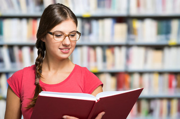 Portrait of a student in a library