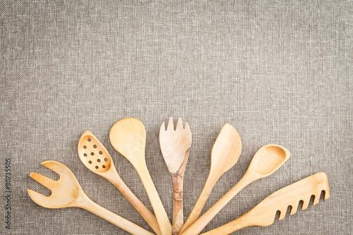 Obraz na plátně Fanned display of wooden kitchen utensils