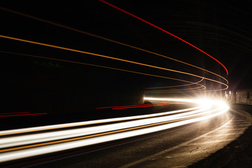 Car light trails in the tunnel.