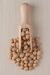 Wall Mural - Wooden scoop with chickpeas