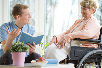 Care assistant reading book