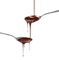 Canvas Print - chocolate syrup dripping from a spoon on a spoon on a white back