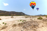 Fototapeta  - Hot air balloon with mountain background
