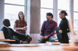 © Jacob Lund - Diverse business team discussing work in office
