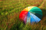 Fototapeta Tęcza - Colorful umbrella outdoors