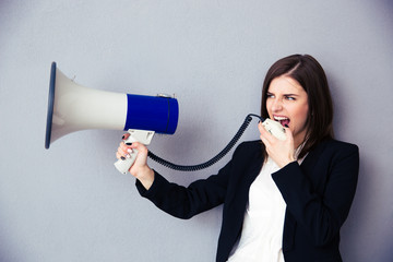 Poster - Beautiful young businesswoman with megaphone