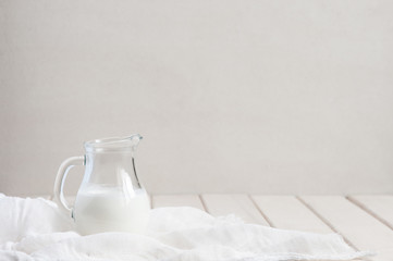 Milk-jug on the white table