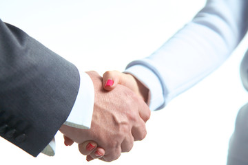 Wall Mural - Closeup of a business handshake, on white background