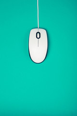 computer mouse on emerald background