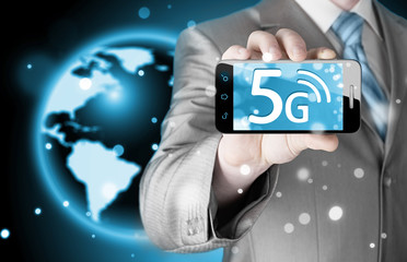 businessman holding in hand 5G, technology background