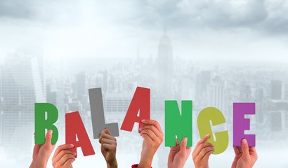 Poster - Composite image of hands holding up balance