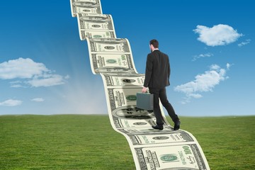 Poster - Composite image of businessman walking while holding briefcase