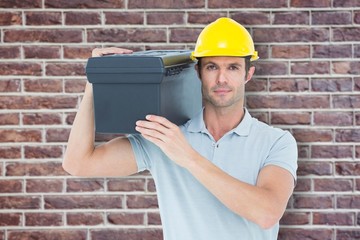 Poster - Confident worker carrying tool box on shoulder