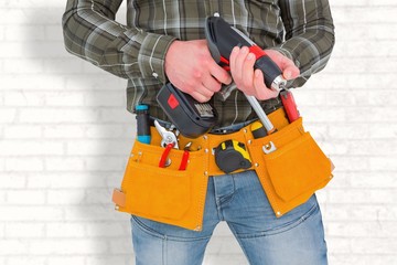 Poster - Manual worker holding gloves and hammer power drill