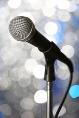 Wall Mural - Microphone on stand on silver background