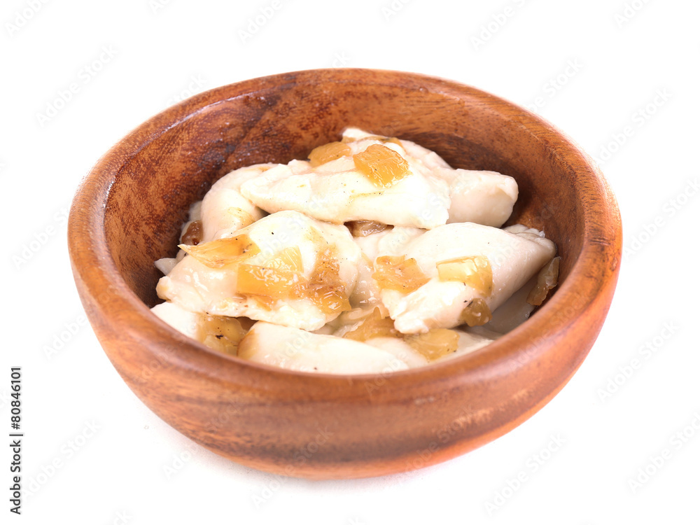 Tasty dumplings with fried onion in brown bowl, isolated