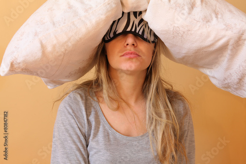 Fotografie, Obraz Sleepy young women with pillow and sleeping eye mask still on.