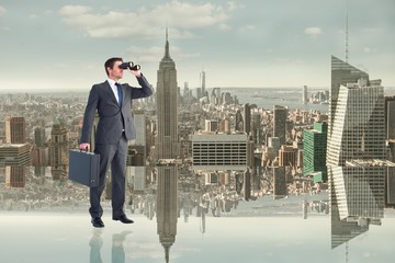 Poster - Composite image of businessman looking through binoculars