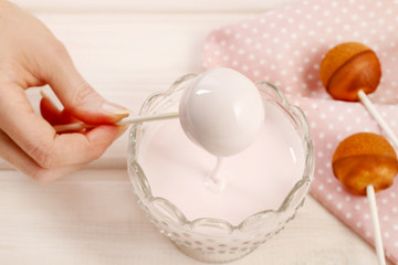 Sticker - Woman making cake pops.